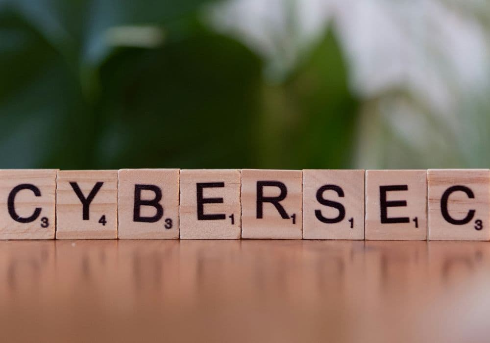 The word ‘CYBERSEC’ spelled out using Scrabble tiles
